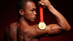 American decathlete Bryan Clay shows off his 2008 Olympic gold medal in a publicity shot.