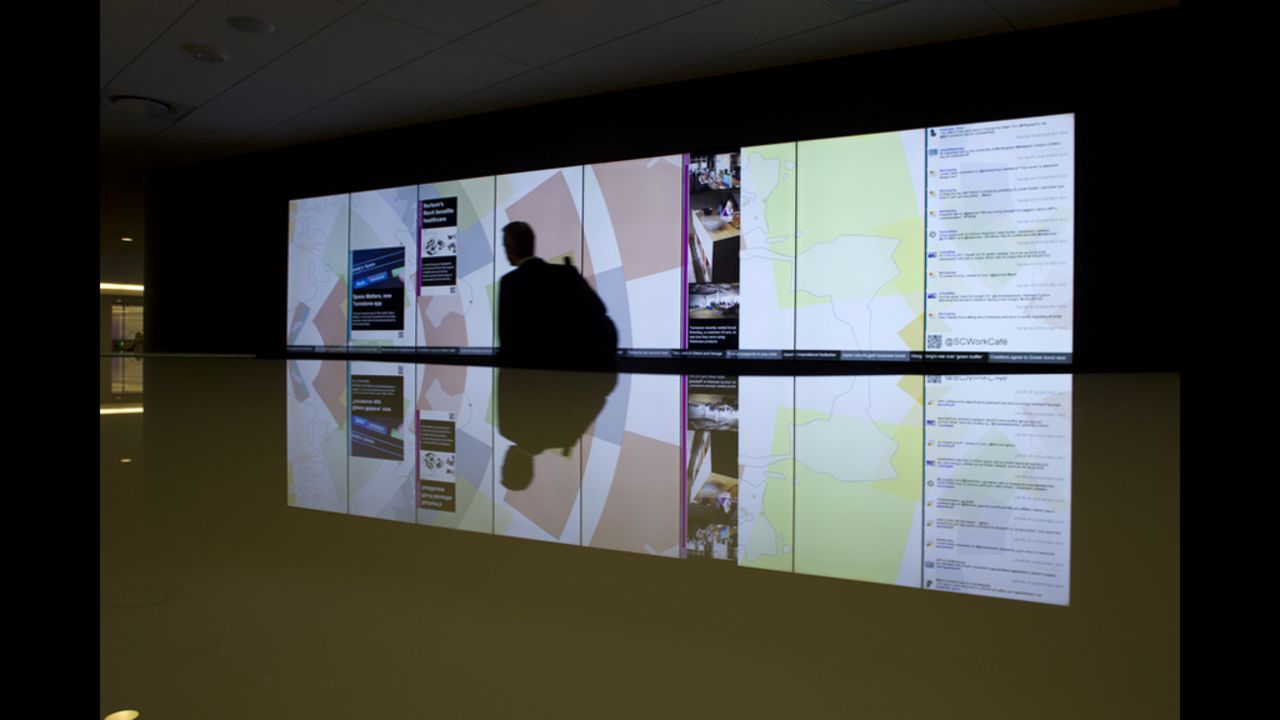 A large video screen in the WorkCafe updates with tweets, news and other information.