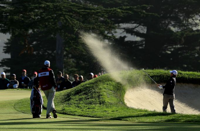 Rory McIlroy of Northern Ireland hits a shot from a bunker on the 10th hole during the second round of the 112th U.S. Open.