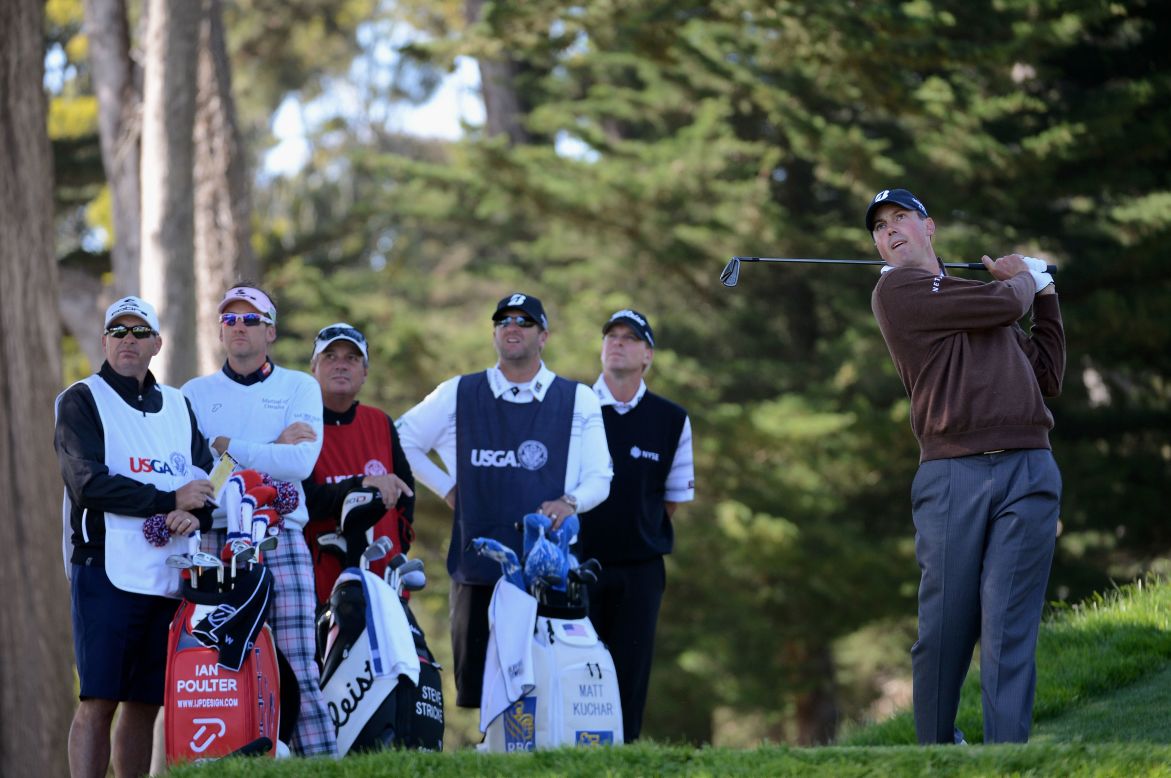 Matt Kuchar of the United States watches his tee shot Friday on the third hole as Ian Poulter of England and Steve Stricker of the United States look on with their caddies.  