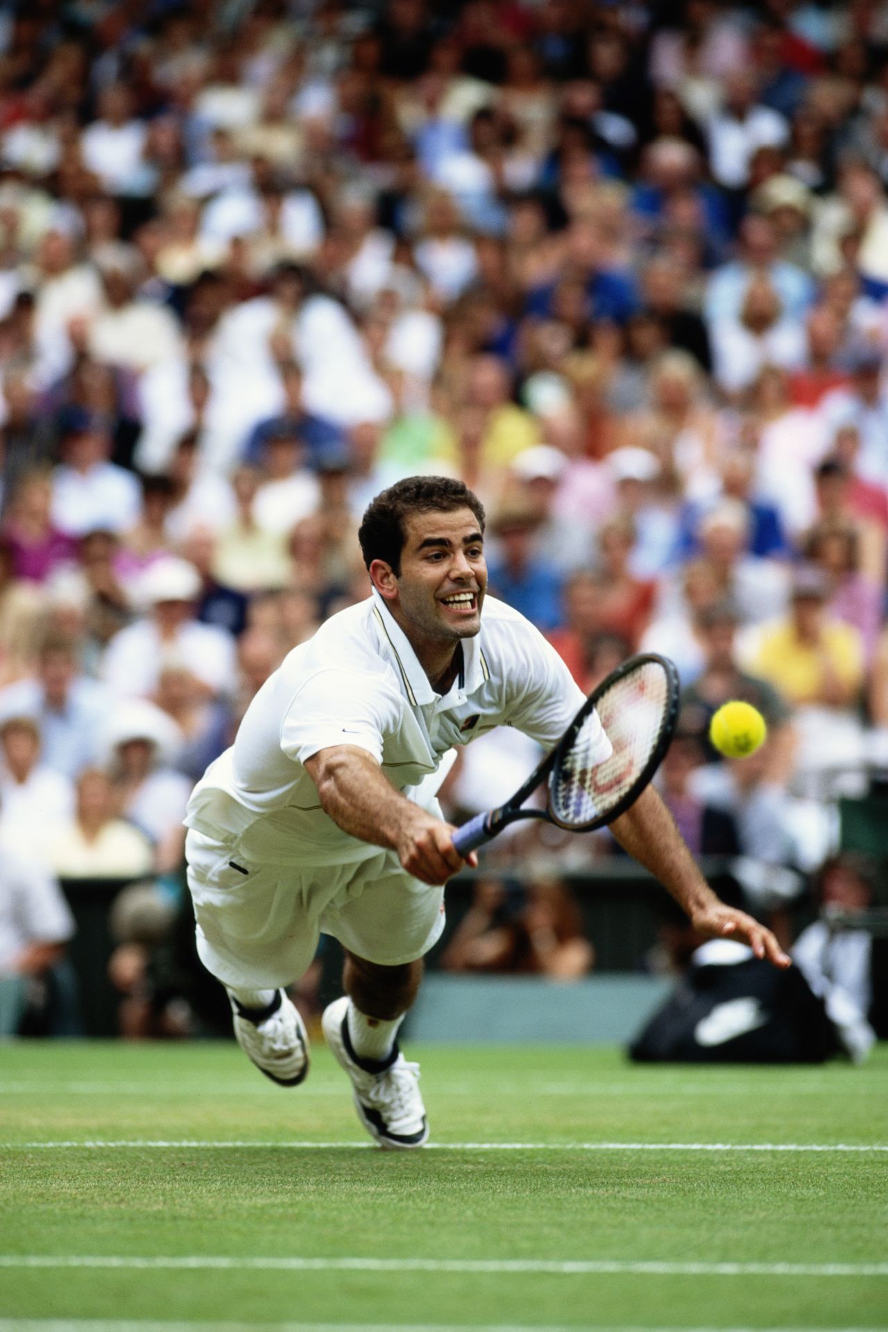 Sampras' powerful serve and volley game earned him seven titles in eight years at the grass-court grand slam. 