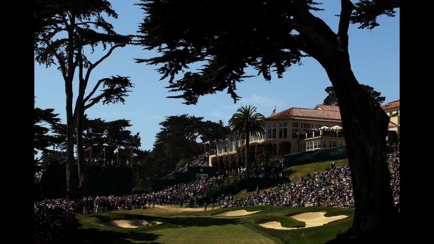 Golfers play the eighth hole during the second round.