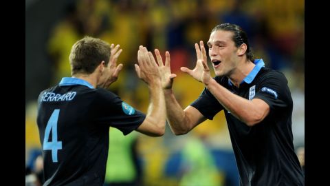Andy Carroll, right, of England celebrates the first goal with captain Steven Gerrard during the match between Sweden and England.