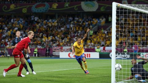 Martin Olsson of Sweden celebrates after Glen Johnson of England fails to stop Olof Mellberg of Sweden's goal during the group D match between Sweden and England on Friday, June 15, in Kiev, Ukraine.