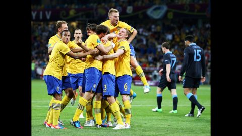 Sweden celebrates after Olof Mellberg of Sweden scored its first goal during the match between Sweden and England.