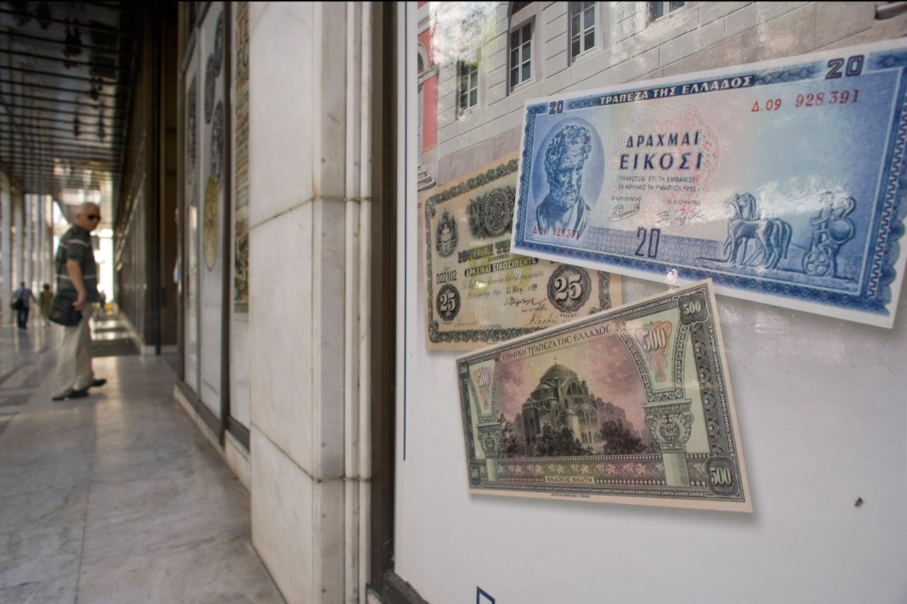 Replica drachma notes are displayed outside a bank on June 14, 2012 in Athens, Greece. The country goes to the polls on June 17, its second election in six weeks. It was called after the May 6 elections failed to deliver a government for the country, which has been struggling with a debt crisis for two years. 