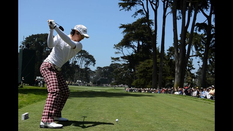 Ryo Ishikawa of Japan hits his tee shot on the tenth hole.