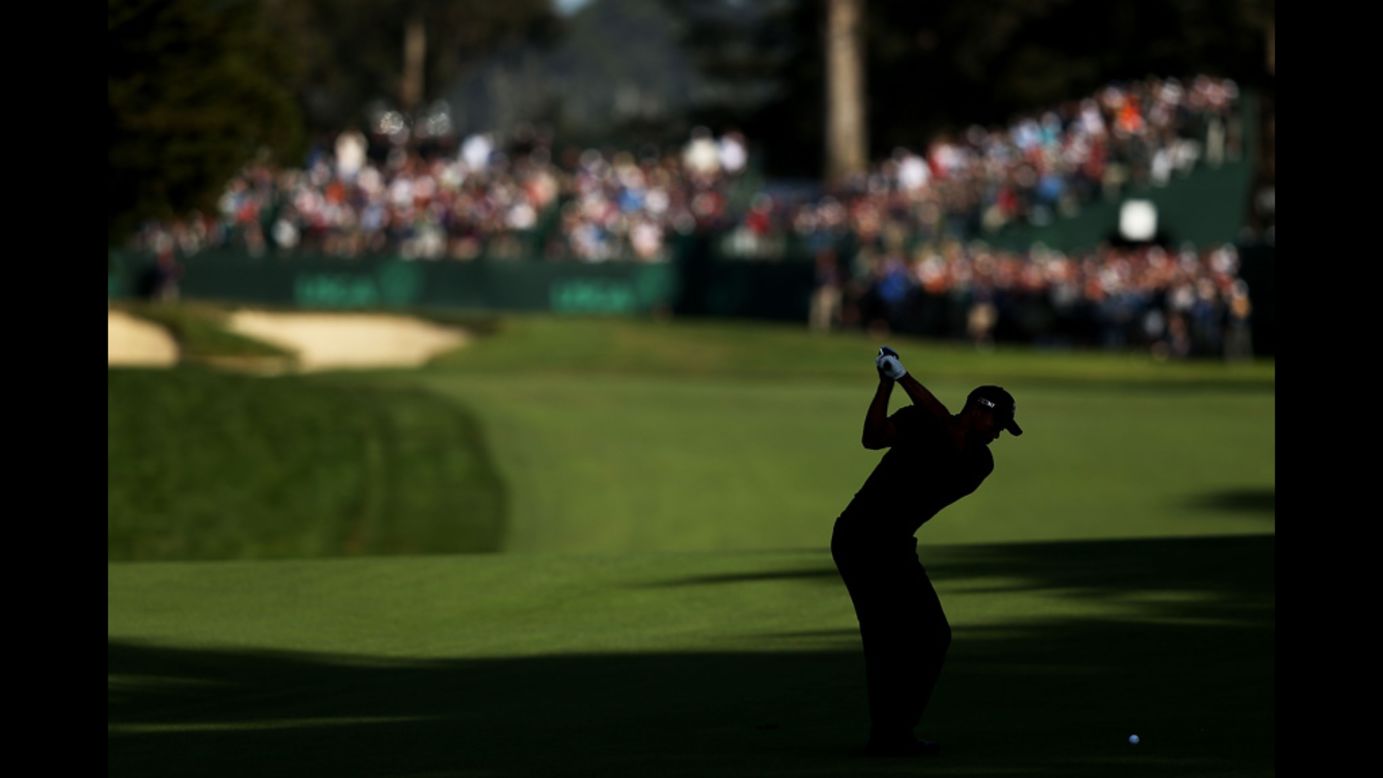 Tiger Woods hits a shot on the 16th hole.