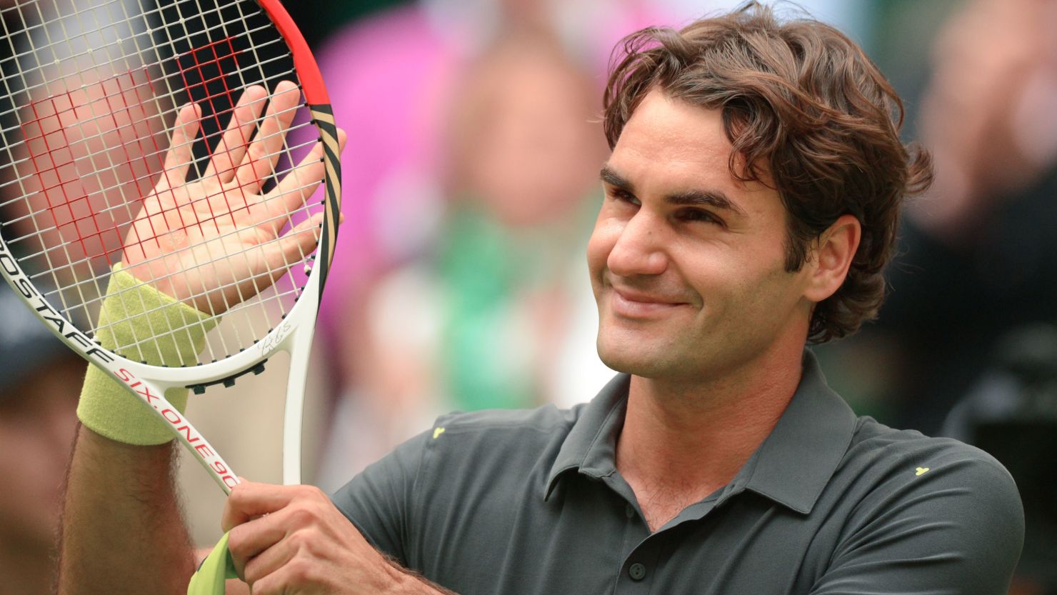 Swiss tennis star Roger Federer smiles after winning his semifinal against Mikhail Youzhny in Halle.