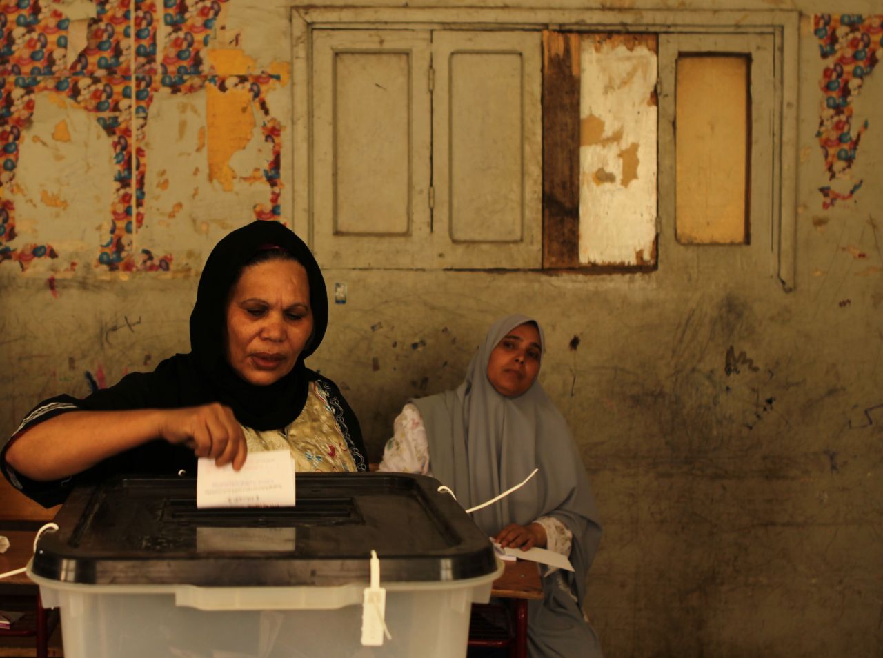 An Egyptian Coptic Christian woman casts her vote in the Cairo Coptic neighborhood of Shubra.