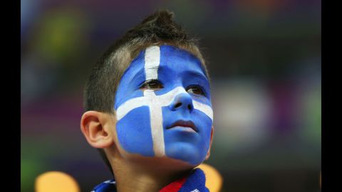 A Greece fan enjoys the atmosphere ahead of the match between Greece and Russia.