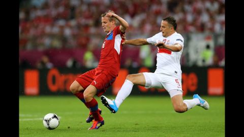 David Limbersky of Czech Republic is tackled by Dariusz Dudka of Poland during the match between Czech Republic and Poland.