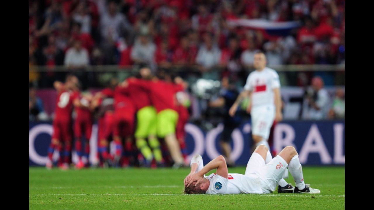 Damien Perquis of Poland lies on the pitch at the final whistle during the match between Czech Republic and Poland.