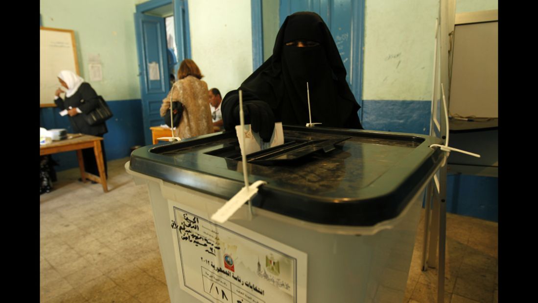 A full-veiled Egyptian woman casts her vote at a polling station in Cairo on June 16.