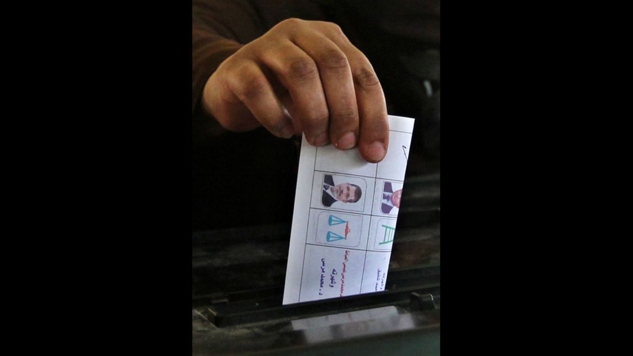 An Egyptian woman casts her ballot in Cairo.
