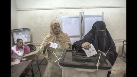 Egyptian women cast their votes at a polling station.