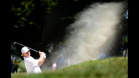 Ernie Els of South Africa plays a bunker shot on the seventh hole during the third round.