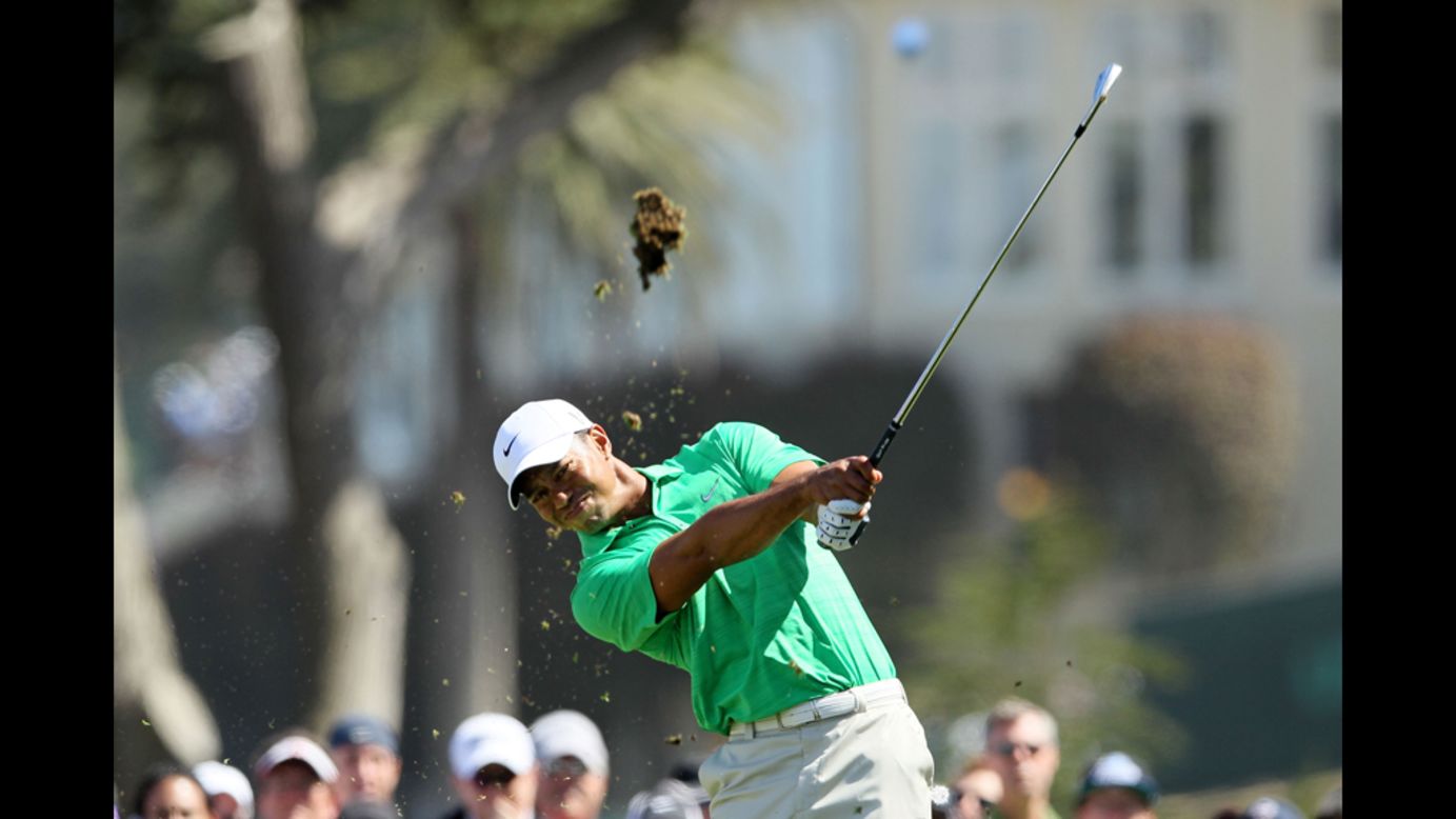 Tiger Woods watches his tee shot on the fourth hole during the third round.
