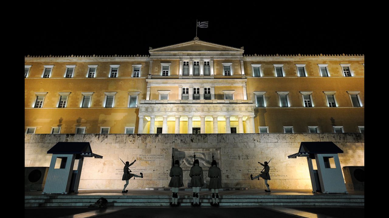 A night before the election, a changing of the guards takes place in front of the Greek parliament in central Athens on Saturday, June 16. 
