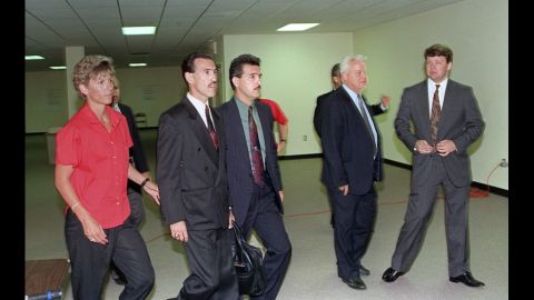 Officers Theodore J. Briseno, second from left, is escorted out of the courthouse on April 29, 1992 after being acquitted of all charges. Laurence M. Powell, right, was acquitted of all but one charge. Hours after the officers' acquittal, rioting and looting broke out in South Central Los Angeles.