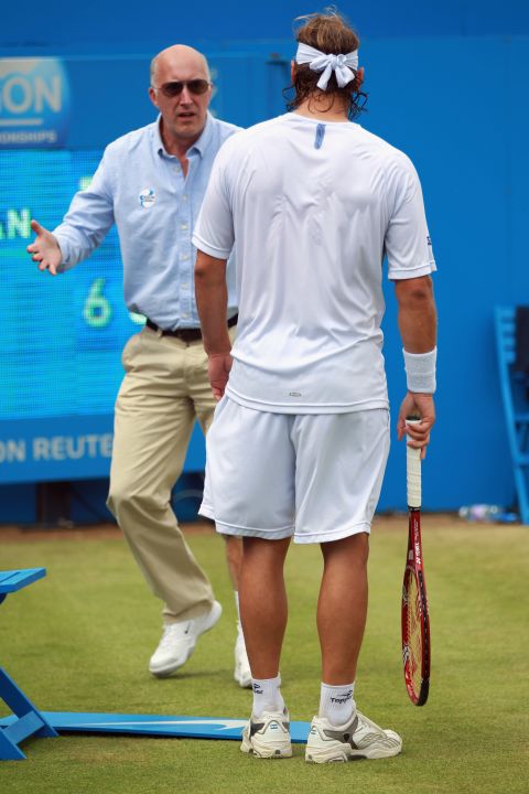Line judge McDougall remonstrates with Nalbandian after the Argentina star's ill-judged kick left him with a gashed leg.