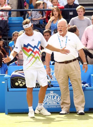 Nalbandian learns his fate from ATP official Tom Barnes as he is disqualified for 'unsporting behavior'