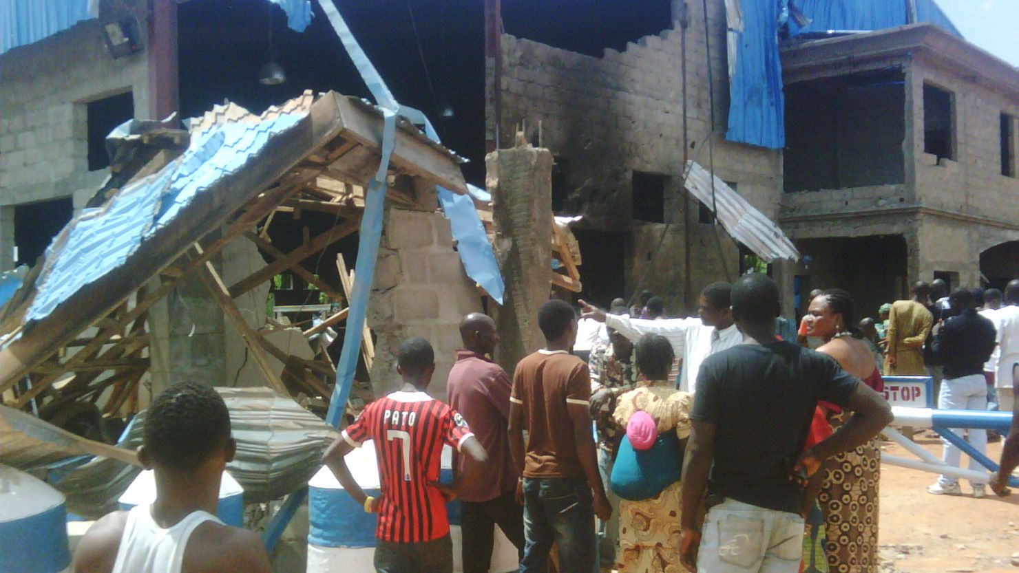 Bystanders outside Sharon Church after it was hit  by a suicide bomb attack in Kaduna, Nigeria,  on Sunday.