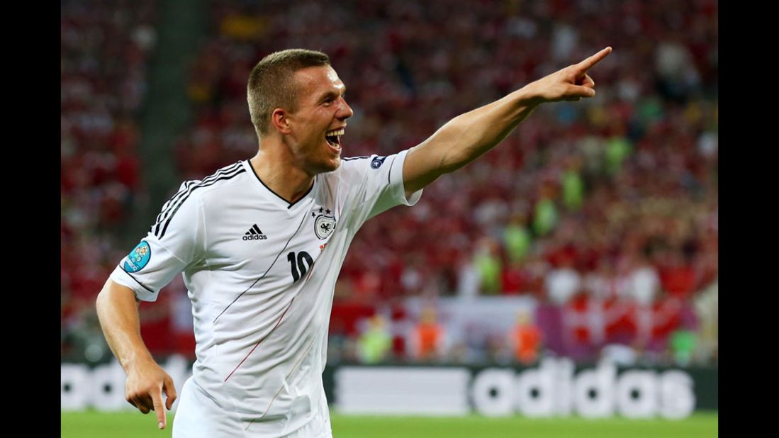 Lukas Podolski of Germany celebrates scoring the first goal against Denmark.