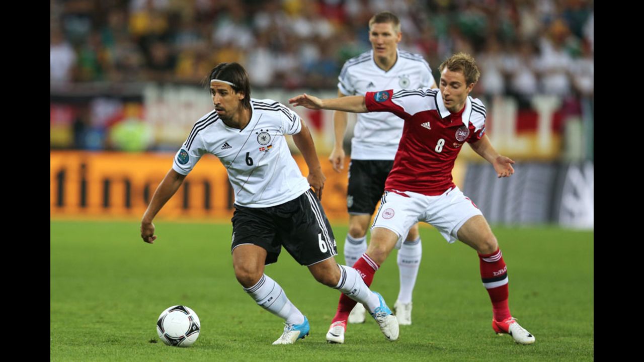Sami Khedira of Germany and Christian Eriksen of Denmark compete for the ball.