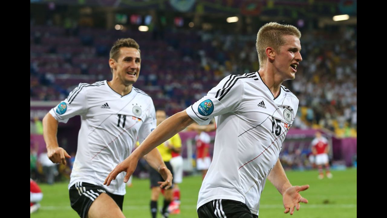 Lars Bender of Germany celebrates with Miroslav Klose after scoring the team's second goal against Denmark in L'viv, Ukraine, on Sunday, June 17. 