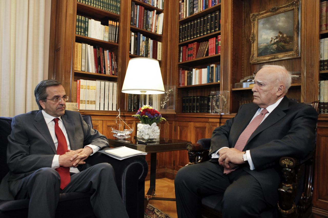 Greek President Karolos Papoulias, right, meets New Democracy leader Antonis Samaras before he receives a mandate to form a government on June 18 in Athens. 