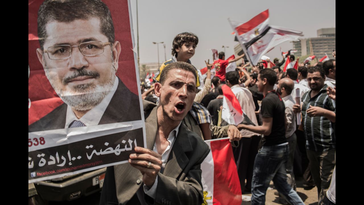 Morsi supporters rally in Cairo's Tahrir Square on Monday, June 18. Morsi declared victory as Egypt's first democratically elected president even as military rulers issued a decree that virtually stripped the position of power.