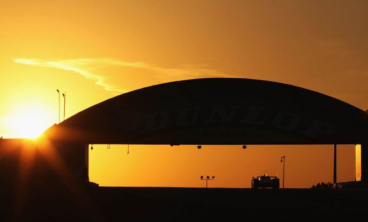  The Audi R18 Etron Quattro speeds around the Circuit de la Sarthe in north-west France as the sun goes down on Saturday.