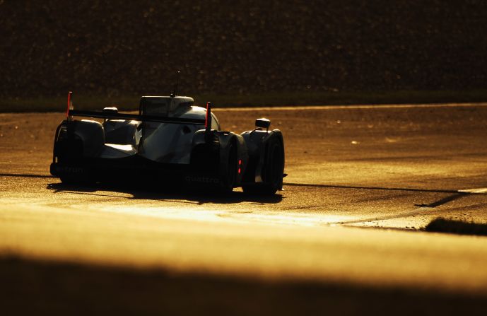 The Audi R18 Etron Quattro of Allan McNish, Rinaldo Cappello and Tom Kristensen in action as the race moved into the night.