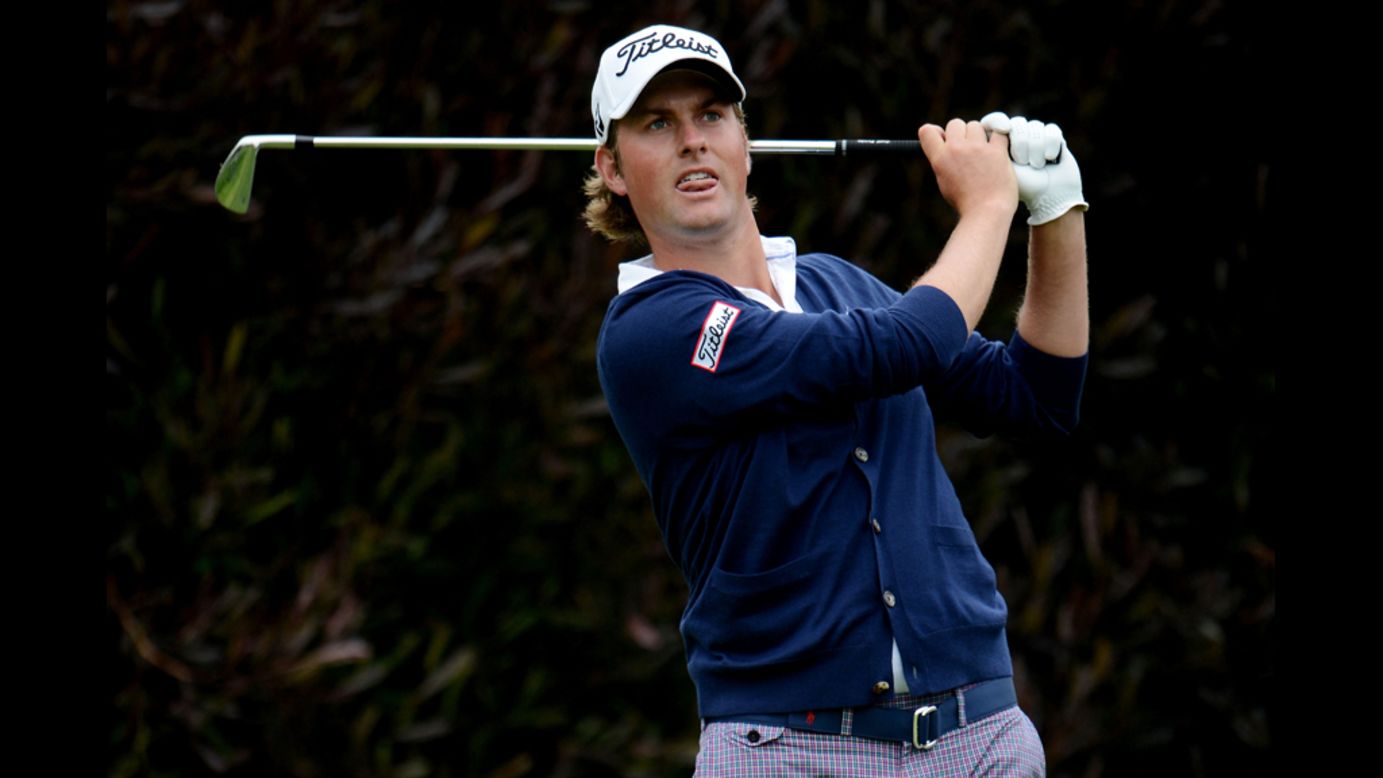Webb Simpson hits his tee shot on the 13th hole of the 112th U.S. Open.