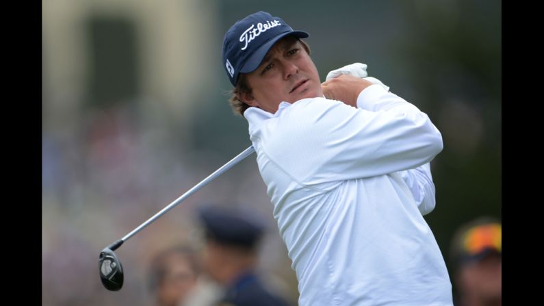 Jason Dufner of the United States watches his tee shot on the fourth hole.