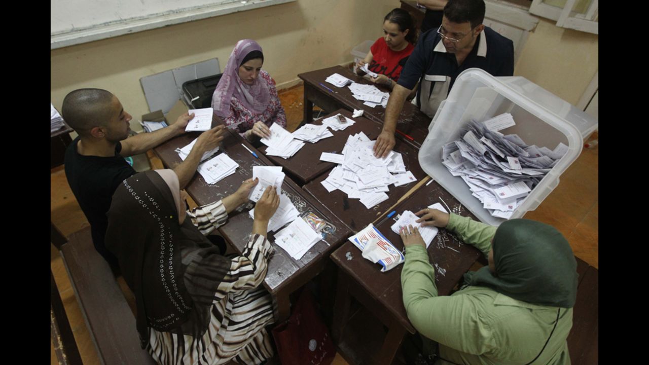 Egyptian election officials count ballots at a polling station in Cairo on Sunday, June 17. The official vote count was scheduled to be finished Monday.