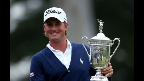 Webb Simpson of the United States holds the U.S. Open trophy after his one-stroke victory in San Francisco on Sunday, June 17. Simpson finished the four-day event at one shot over par to secure his first major title.