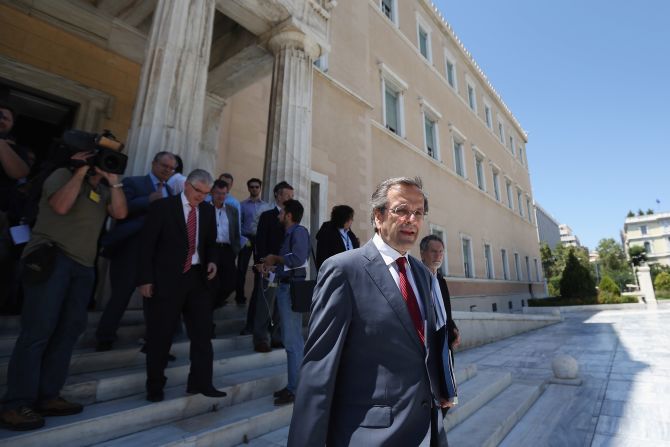 Antonis Samaras leader of the New Democracy party, leaves the Parliament building following a meeting with the leader of Syriza, Alexis Tsipras, to attempt to form a coalition government on June 18, 2012 in Athens, Greece.