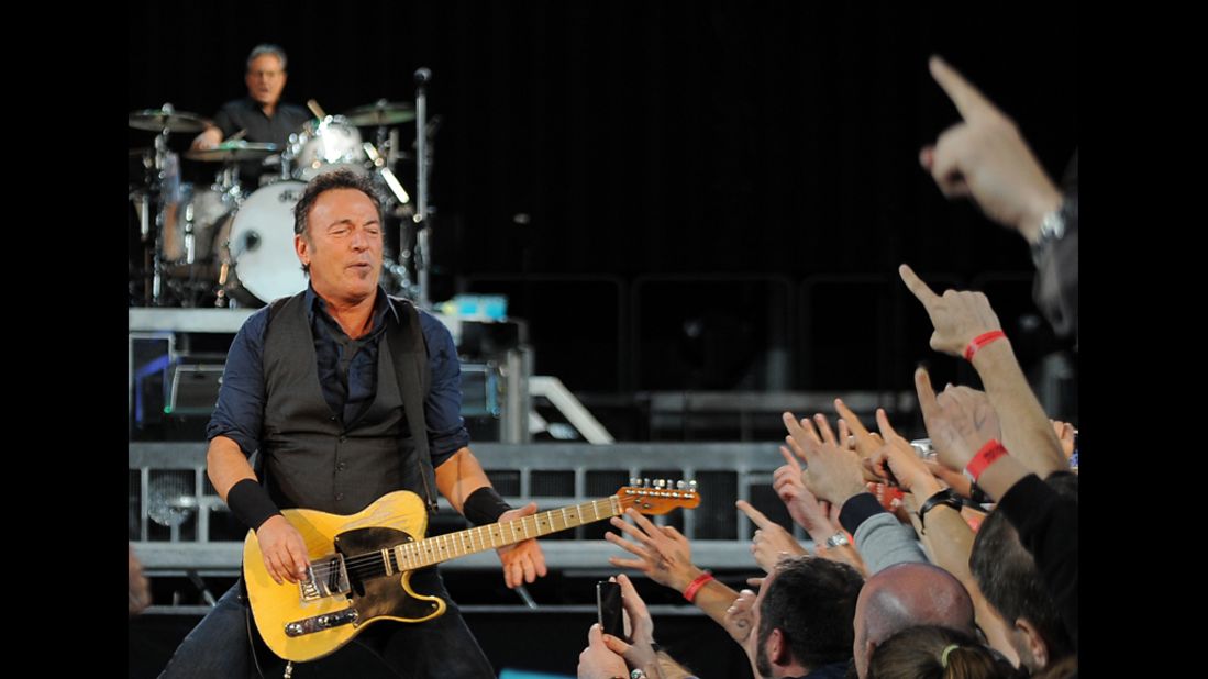 Known for his lengthy and intense concerts, Springsteen performs with the E Street Band in Barcelona, Spain, in May 2012. His concerts are marathons that can run three hours or more.