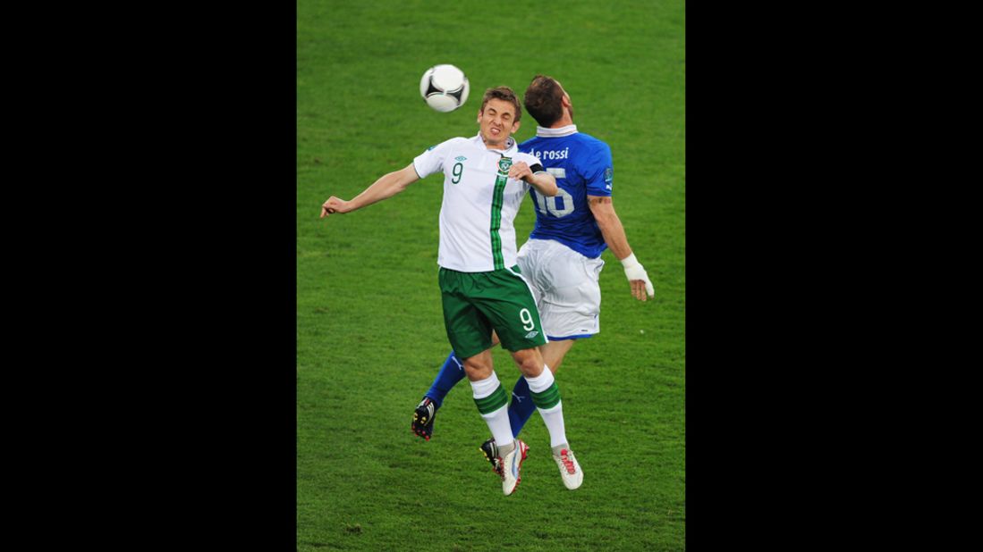 Kevin Doyle of Ireland and Daniele De Rossi of Italy jump for the ball on Monday.