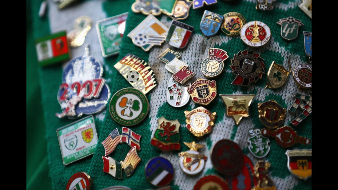 Badges adorn an Ireland fan's scarf ahead of the group C match between Italy and Ireland.