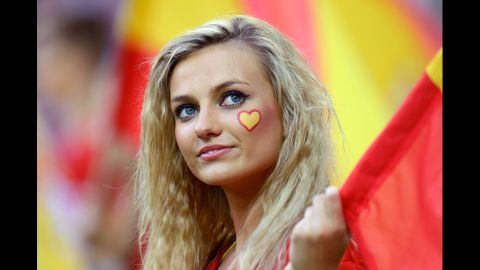 A fan awaits the action before the start of the match between Croatia and Spain.