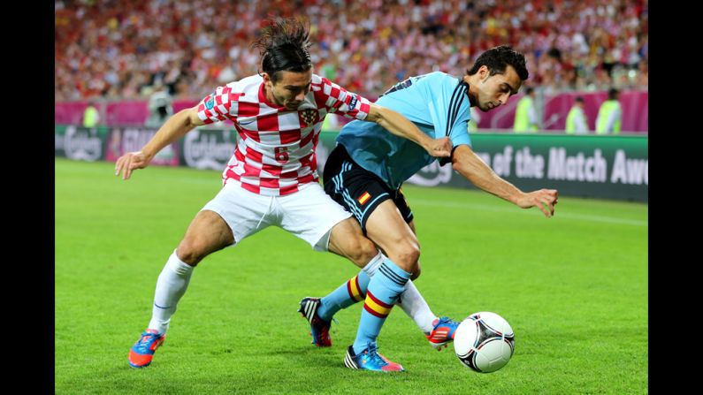 Danijel Pranjic of Croatia and Alvaro Arbeloa of Spain compete for the ball.