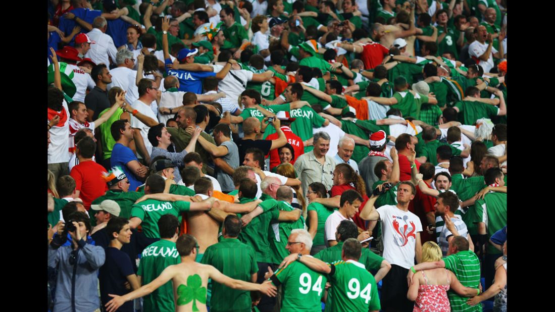 Ireland fans do the Poznan as they enjoy the atmosphere during the match against Italy.