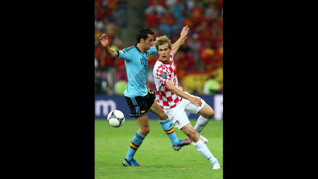 Spain's Alvaro Arbeloa and Croatia's Ivan Strinic fight for the ball during the group C match at Municipal Stadium in Gdansk, Poland, on Monday, June 18. 