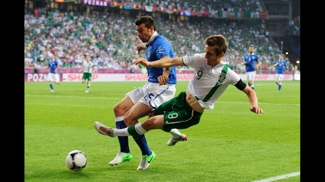 Italy's Andrea Barzagli tackles Ireland's Kevin Doyle on Monday.