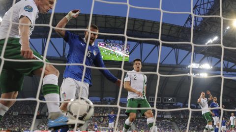 Republic of Ireland's Damien Duff fails to prevent Antonio Cassano's header from crossing the line for Italy's opening goal