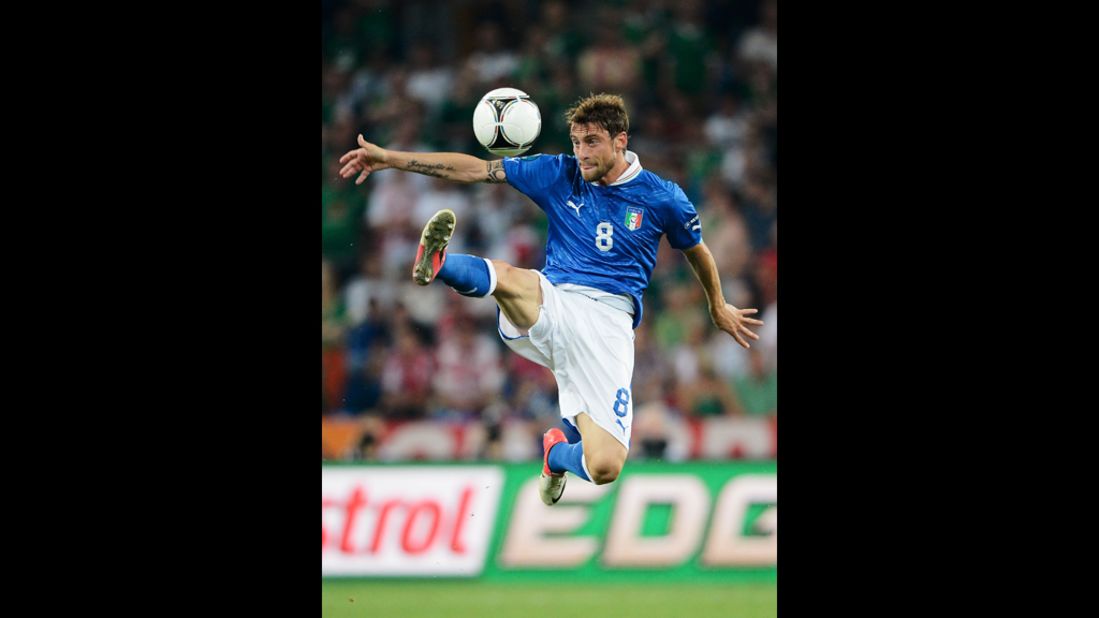 Italy's Claudio Marchisio jumps to control the ball during the match against Ireland.