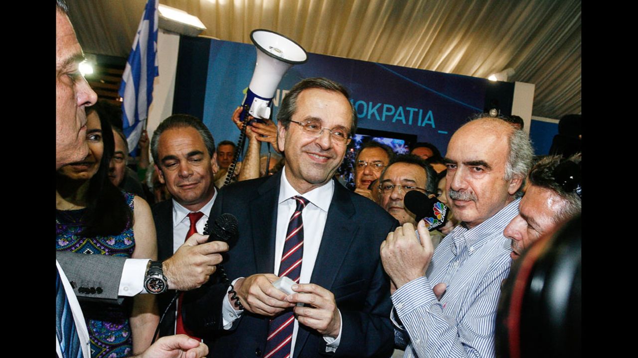New Democracy leader Antonis Samaras smiles at supporters in Athens on Sunday, June 17. His center-right, pro-bailout party came out on top in the country's parliamentary elections.